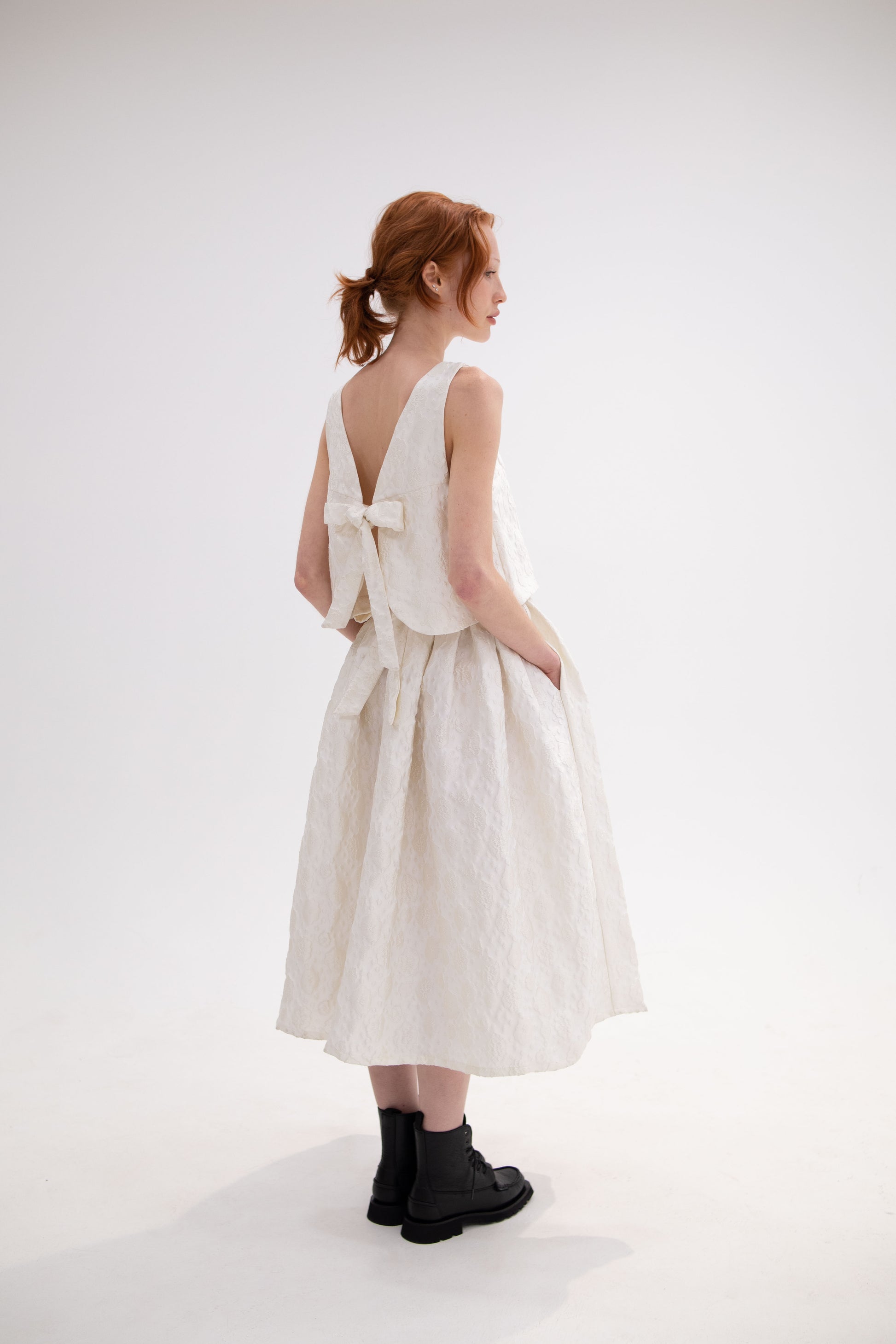 Monique white, two piece ensemble with hand tied bow and cloud details, romantic and sophisticated